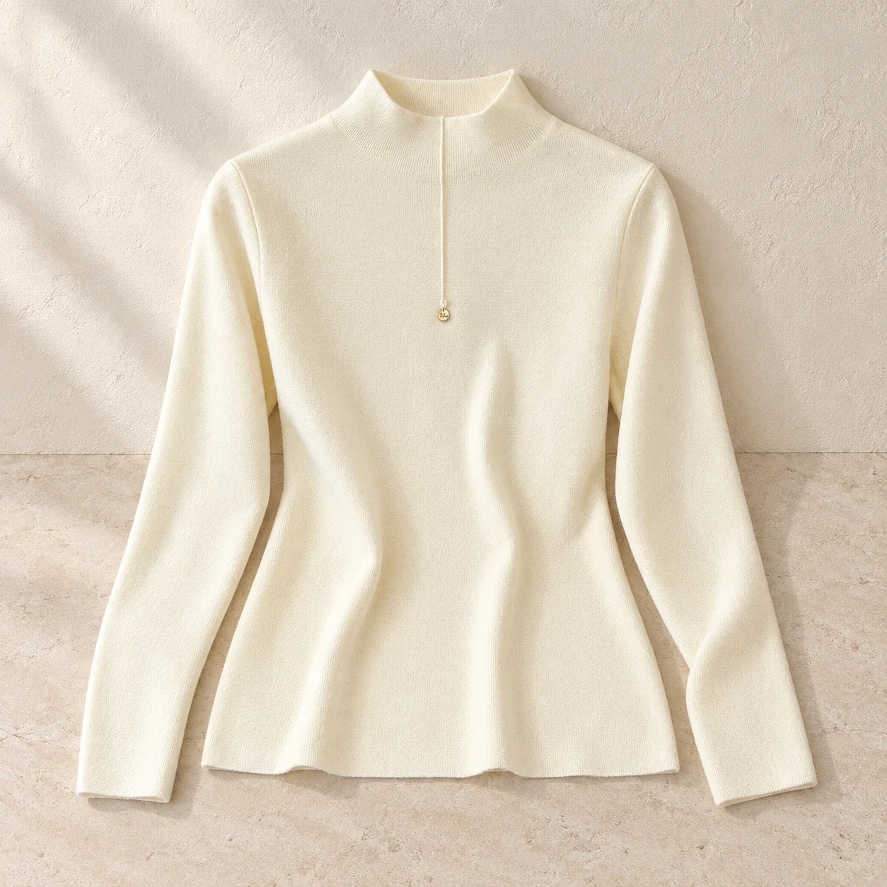 Pale ivory mock-neck knit: full product view